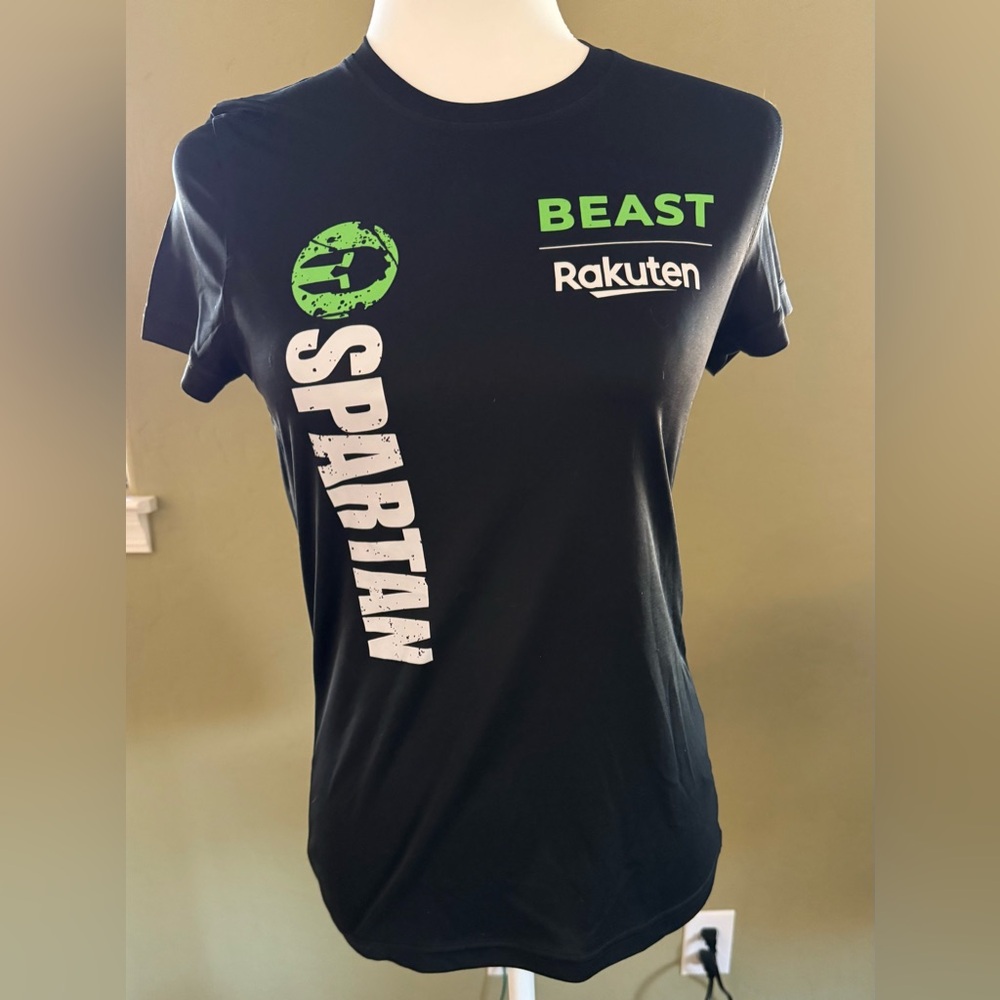 Craft Women’s Black Short Sleeve Spartan Beast Rakuten Tee with Green Logo